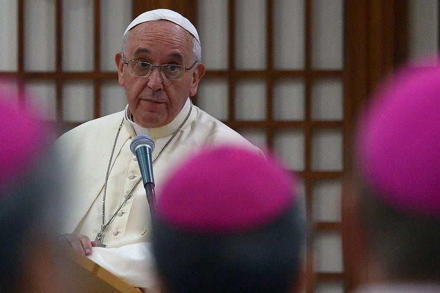 Pope Francis (centre) speaks during a meeting with Catholic bishops from 22 Asian countries at a martyrs' shrine some 150 kilometres south of Seoul on Aug 17, 2014, on the penultimate day of a visit to South Korea.&nbsp;Pope Francis on Sunday champio