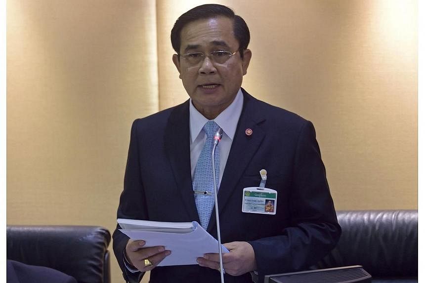Thailand's army chief and head of the National Council for Peace and Order, General Prayut Chan-O-Cha, reads statements to members of theNational Legislative Assembly (NLA) at Parliament in Bangkok on Monday, Aug 18, 2014.&nbsp;General Chan-ocha, sub