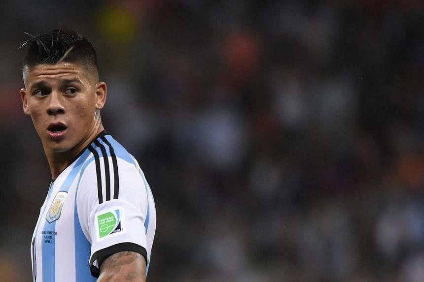 Argentina's defender Marcos Rojo reacts during the second half of extra time during the semi-final football match between Netherlands and Argentina of the FIFA World Cup on July 9, 2014. Rojo is sure that he will complete his €20 million (S$33 mill