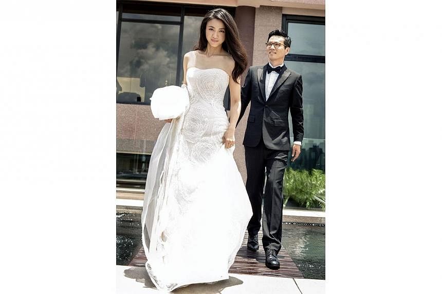 Chinese actress Tang Wei, 34, went for an unadorned look for her wedding with South Korean director Kim Tae Yong, 44, in pictures released today.&nbsp;-- PHOTO: TANG WEI