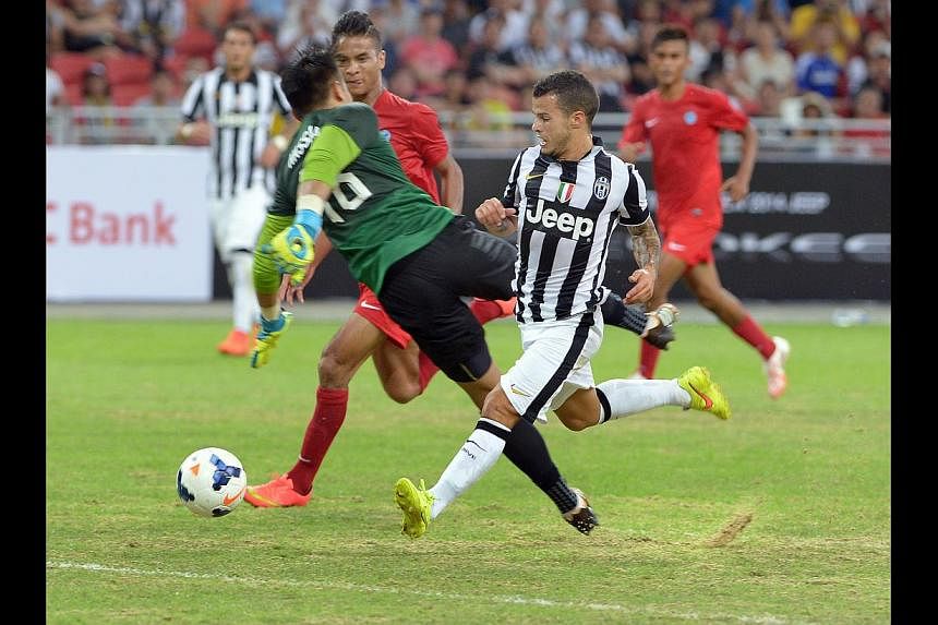 Players from both the Singapore Selection (red) and Juventus (black and white) lamented the sandy conditions of the National Stadium pitch. It will now undergo works to improve it ahead of a packed calendar.