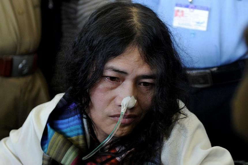 In this photograph taken on March 3, 2013 social activist from Manipur, Irom Sharmila, who has been on a fast for 12 years demanding the repeal of the controversial Armed Forces Special Powers Act (AFSPA), arrives at the Indira Gandhi International A