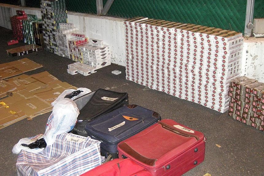 Bags filled with contraband cigarettes seized by the Singapore Customs. -- PHOTO: ICA
