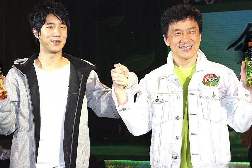 Hong Kong action star Jackie Chan and son Jaycee at an endorsement event in Shanghai in April 2008. -- PHOTO: APPLE DAILY