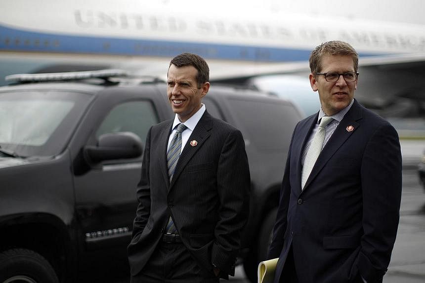 David Plouffe (left), senior adviser to US President Barack Obama and White House Press Secretary Jay Carney are pictured upon their arrival in Swanton, Ohio, in this September 26, 2012, file photo. Uber has enlisted Plouffe, President Obama's 2008 c