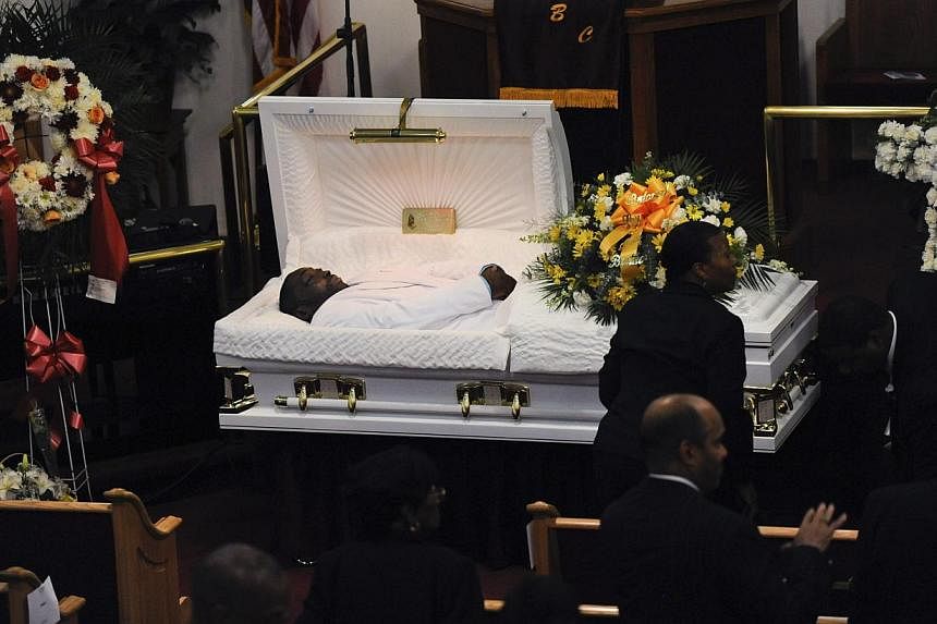 Mourners gather at the funeral service for Eric Garner at Bethel Baptist Church in Brooklyn New York on July 23, 2014. It was announced on Tuesday that a grand jury will be convened to probe the death of the 43-year-old father of six who was wrestled