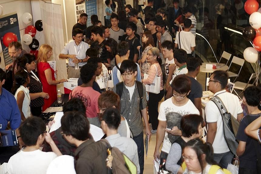 Crowds at Singapore Institute of Technology's (SIT) open house in January 2013. SIT has partnered with 11 accounting firms to host students in its first work-study programme. -- PHOTO: SINGAPORE INSTITUTE OF TECHNOLOGY