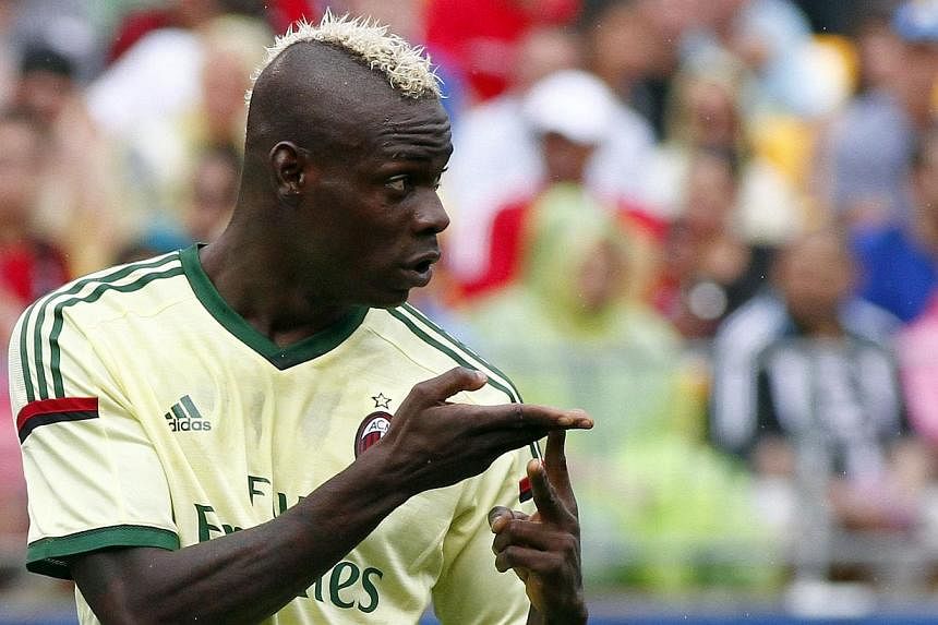 Mario Balotelli of AC Milan signals to teammates against Manchester City during International Champions Cup 2014 at Heinz Field on July 27, 2014, in Pittsburgh, Pennsylvania. -- PHOTO: AFP