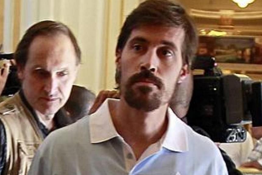 US journalist James Foley (front), after being released by the Libyan government in Tripoli, in a picture taken on May 18, 2011. The US government confirmed on Wednesday that a video released online Tuesday by Islamic State militants that purported t