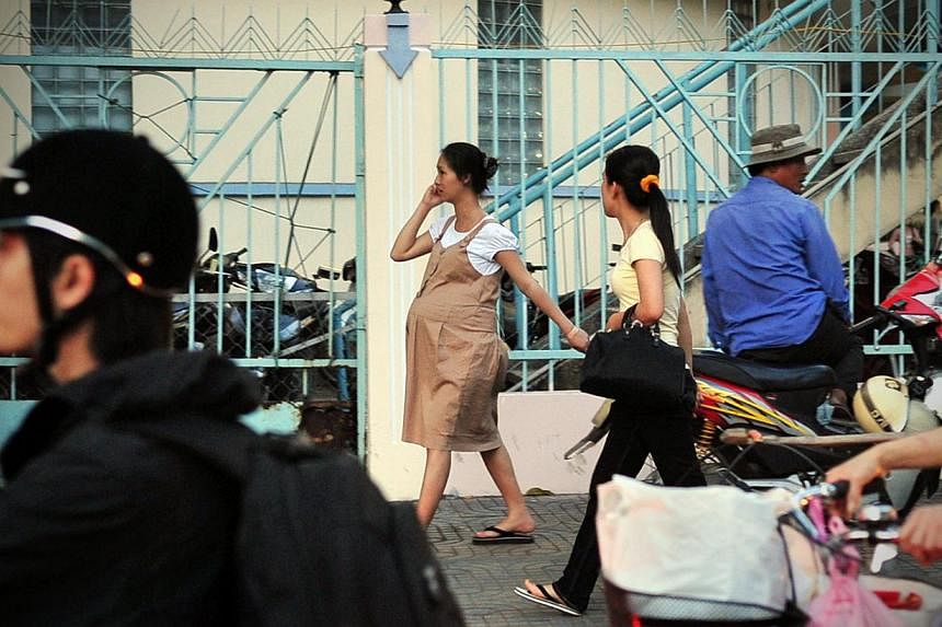 Migration can strain the family unit. In Vietnam, about half of female migrants to Hanoi and Ho Chi Minh City (above) are married, and over 80 per cent of those married when they first move have at least one child.