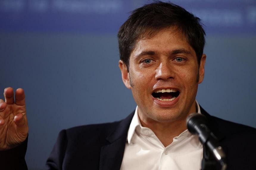 Argentina's Economy Minister Axel Kicillof gestures as he speaks during a news conference in Buenos Aires on August 20, 2014. President Cristina Kirchner&nbsp;on Tuesday unveiled legislation that seeks to push bondholders to swap defaulted debt for n