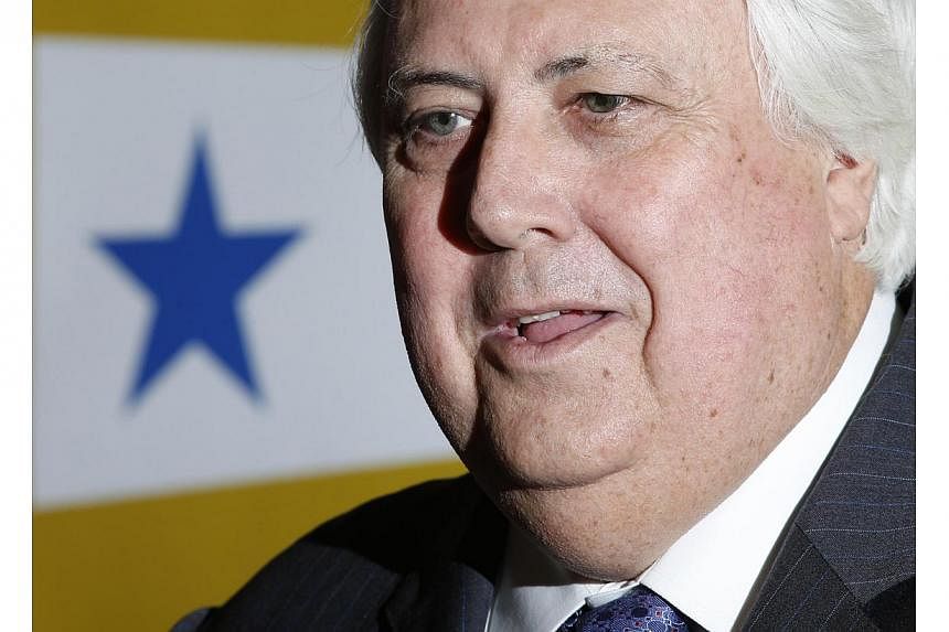 A 2013 file photo of Australian billionaire Clive Palmer speaking at a news conference in London. China's foreign ministry has condemned a verbal attack by the mining mogul and politician as irrational and absurd, after he described China's governmen