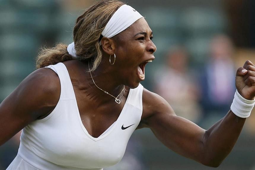 Serena Williams of the US reacts during a women's singles tennis match at the Wimbledon Tennis Championships, in London on June 28, 2014. The World No. 1 is also the top seed for this year's US Open, which opens on Monday at Flushing Meadows.&nbsp;--