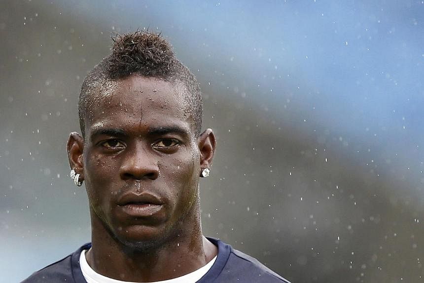 Italy's national soccer team player Mario Balotelli attends a practice session at the Dunas Arena soccer stadium in Natal on June 23, 2014. -- PHOTO: REUTERS