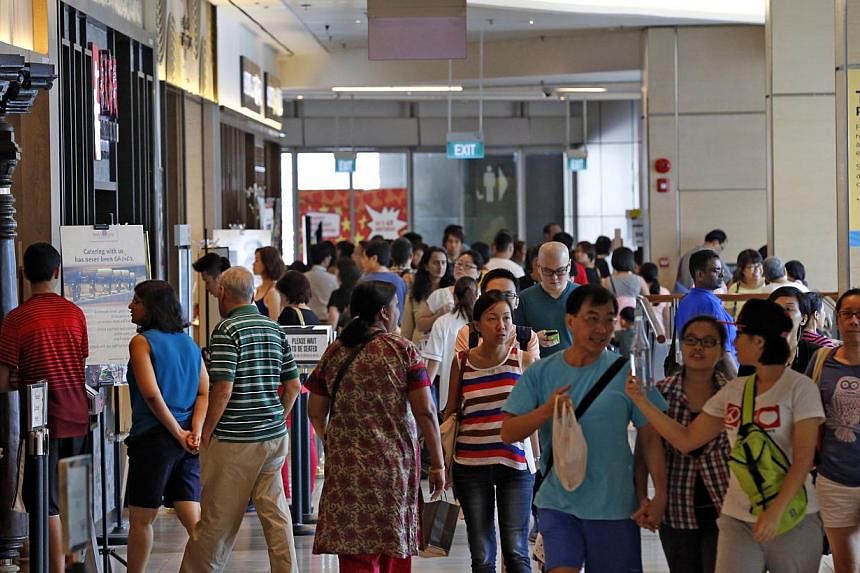 The basement of Suntec City Mall near the Fountain of Wealth was packed on Sunday. Tenants say consumer traffic has improved since the section reopened last year.