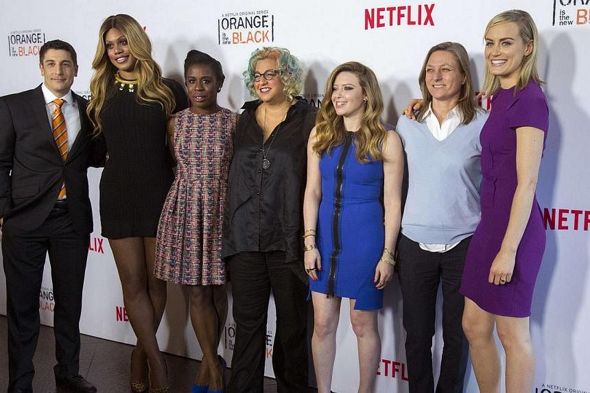 Creator Jenji Kohan (centre) poses with Netflix vice-president of original content Cindy Holland (second from right) and cast members (from left) Jason Biggs, Laverne Cox, Uzo Aduba, Natasha Lyonne and Taylor Schilling at a panel for Orange Is the Ne