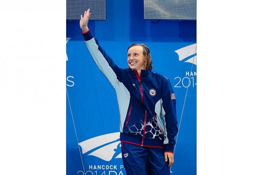 Katie Ledecky smashed another world record as Michael Phelps claimed his first individual gold medal post-retirement at the Pan Pacific Championships in Australia on Saturday, Aug 23, 2014. -- PHOTO: AFP