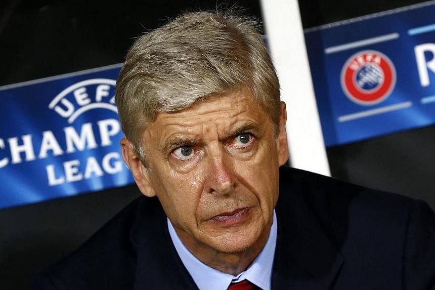 Arsene Wenger admits Arsenal's status as serious contenders for the Premier League title will be given a stern examination by Everton on Saturday, Aug 23, 2014. -- PHOTO: REUTERS