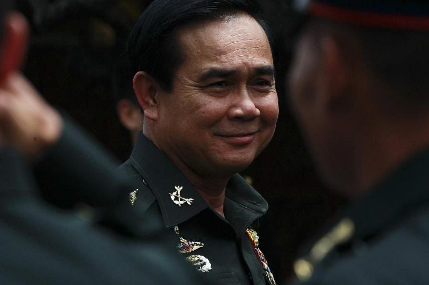 Martial law will remain in effect after junta leader Prayuth Chan-ocha becomes prime minister, according to a spokesperson for the ruling National Council for Peace and Order (NCPO).&nbsp;-- PHOTO: REUTERS