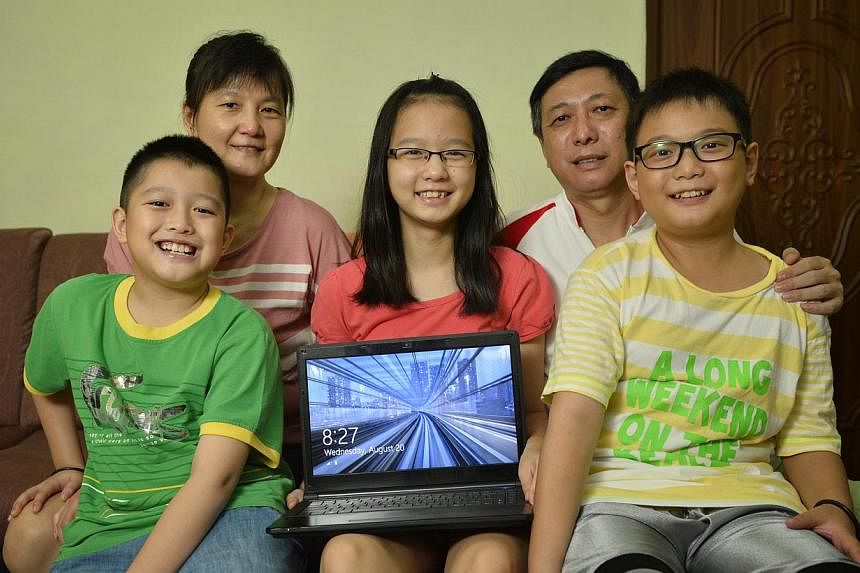 The Welfords –&nbsp; Alexandria, dad John, Ashley, mum Elisa, Victoria and Nicole – and the Chans – (from far left) Yi Xuan, mum Teoh Geik Luang, Yu Fan, dad Ming Kiat and Yu Heng – are among families here who cannot afford to buy a computer 