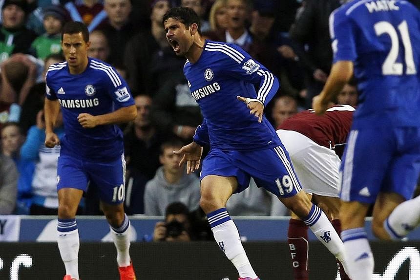 Chelsea's Diego Costa (centre) celebrates his goal against Burnley during their English Premier League soccer match at Turf Moor in Burnley, northern England on Aug 18, 2014. -- PHOTO: REUTERS&nbsp;