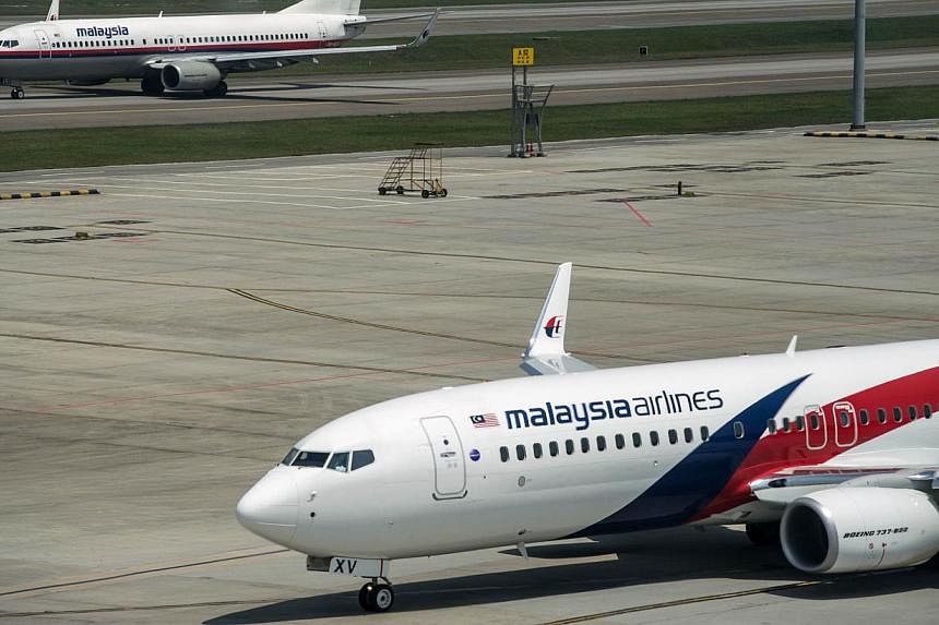 This file photo taken on July 21, 2014 shows Malaysia Airlines planes on the tarmac at Kuala Lumpur International Airport in Sepang. -- PHOTO: AFP