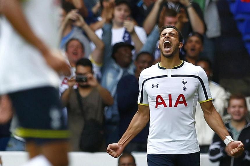 Tottenham Hotspur's Nacer Chadli (right) celebrates after scoring his second goal against Queens Park Rangers during their English Premier League soccer match at White Hart Lane in London on Aug 24, 2014.&nbsp;Nacer Chadli ruined Harry Redknapp's ret