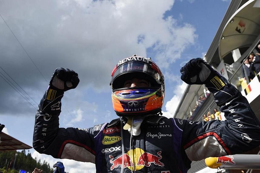 Red Bull Racing's Australian driver Daniel Ricciardo celebrates in the parc ferme at the Spa-Francorchamps circuit in Spa on Aug 24, 2014, after the Belgium Formula One Grand Prix.&nbsp;Australian Daniel Ricciardo claimed his third race victory of th