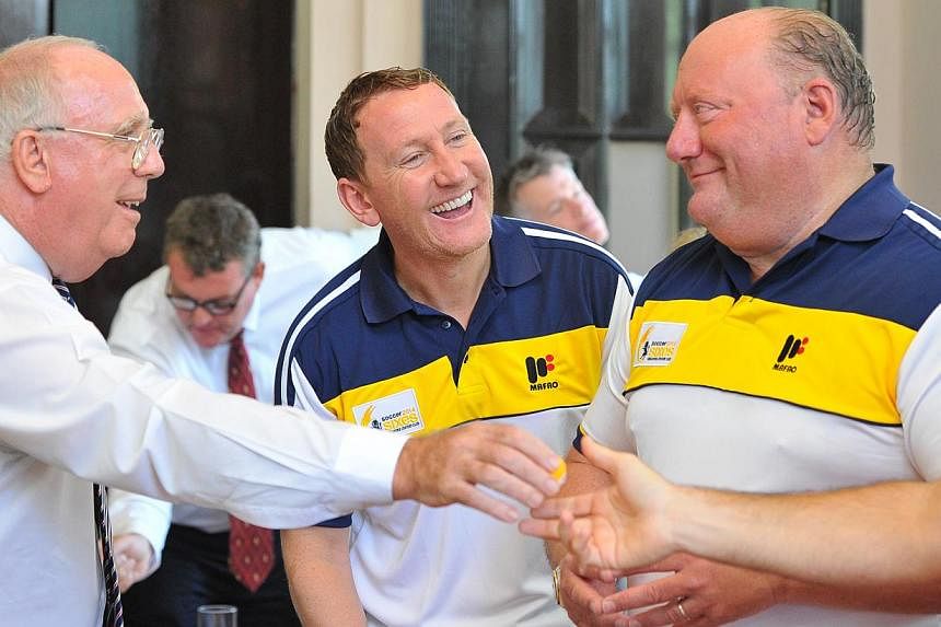 Mr Michael Grice, President of Singapore Cricket Club (left) chatting with football legends Mr Ray Parlour (centre) and Mr Alan Brazil at the tournament draw for the Singapore Cricket Club International Soccer Sixes at Singapore Cricket Club on May 1