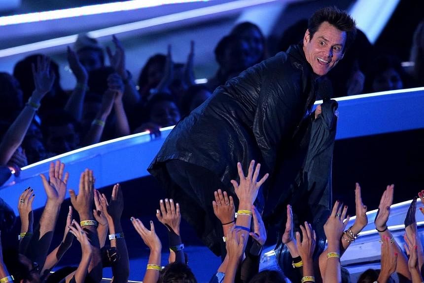 Actor Jim Carrey speaks onstage during the 2014 MTV Video Music Awards at The Forum on Aug 24, 2014 in Inglewood, California. -- PHOTO: AFP
