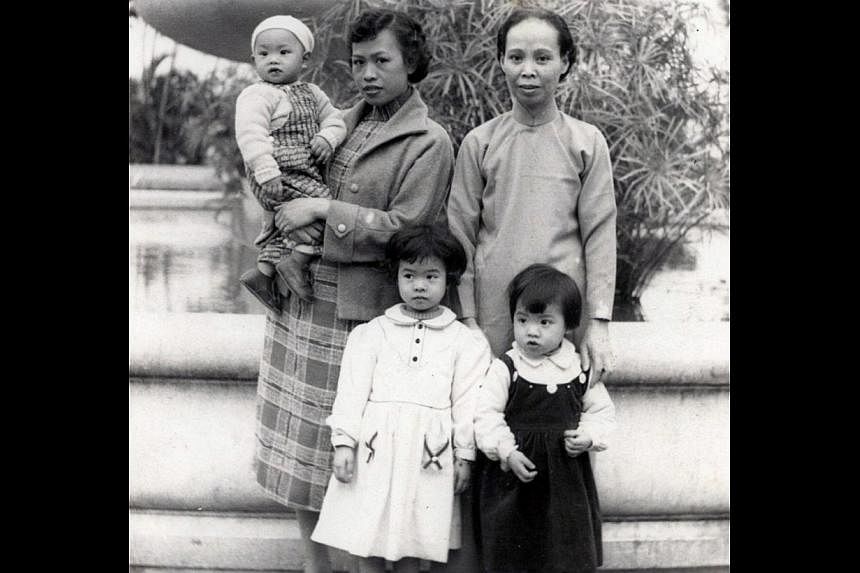 Liong (in white dress) with her mother, grandmother and siblings at Victoria Park in Hong Kong in the late 1950s. -- PHOTO: COURTESY OF ANGELA LIONG