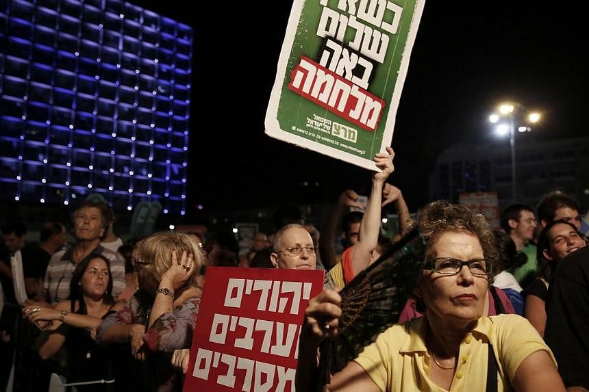 Israelis at a peace rally calling on the Israeli government to negotiate with the Palestinian Authority. Mass rallies aside, the writers find that positive personal contact among individuals from opposing groups can help pave the way towards peace.