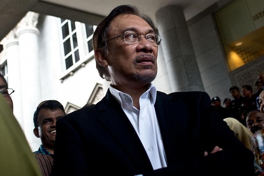 Malaysian opposition leader Anwar Ibrahim has rejected offers of asylum abroad ahead of a final appeal in October on a sodomy conviction that could see him jailed, a political aide said on Monday. -- PHOTO: AFP