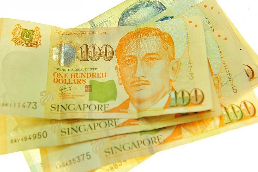 The taxman had a bumper year in the last financial year, adding a record amount to the government's coffers as tax arrears fell to an all-time low. -- PHOTO: ST FILE