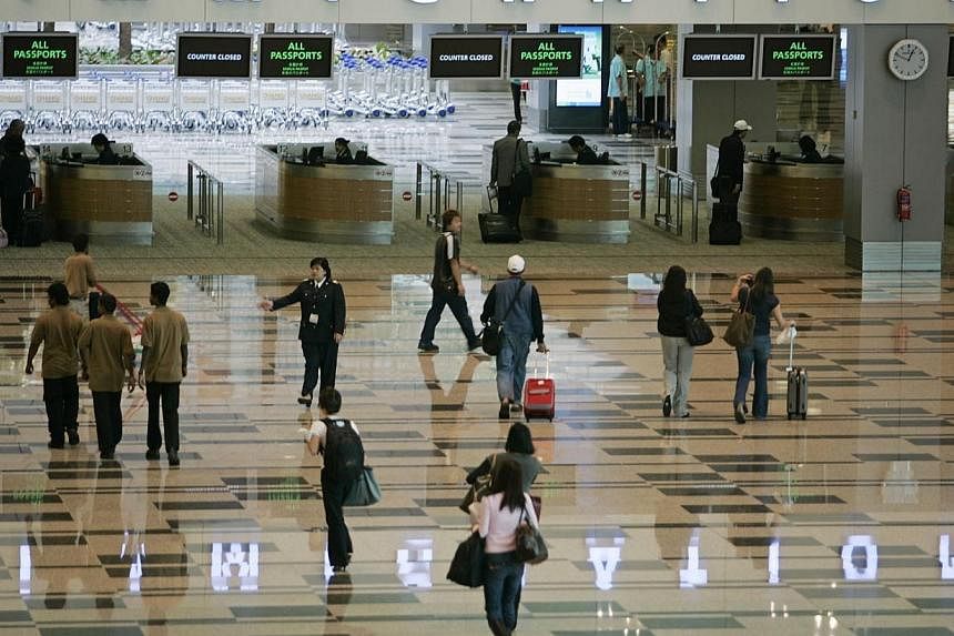 From Sept 1, foreign visitors and Singapore residents will be required to make a declaration if the money they carry in or out of the country exceeds S$20,000. -- PHOTO: ST FILE