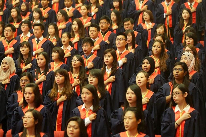 National Institute of Education (NIE) graduates reciting the teacher's pledge during a graduation ceremony held at Nanyang Technological University on July 9, 2014. -- PHOTO: ST FILE