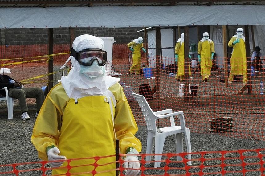 Medicins Sans Frontieres (MSF) health workers prepare at ELWA's isolation camp during the visit of Senior United Nations System Coordinator for Ebola David Nabarro, at the camp in Monrovia on Aug 23, 2014.&nbsp;The head of the US Agency for Internati