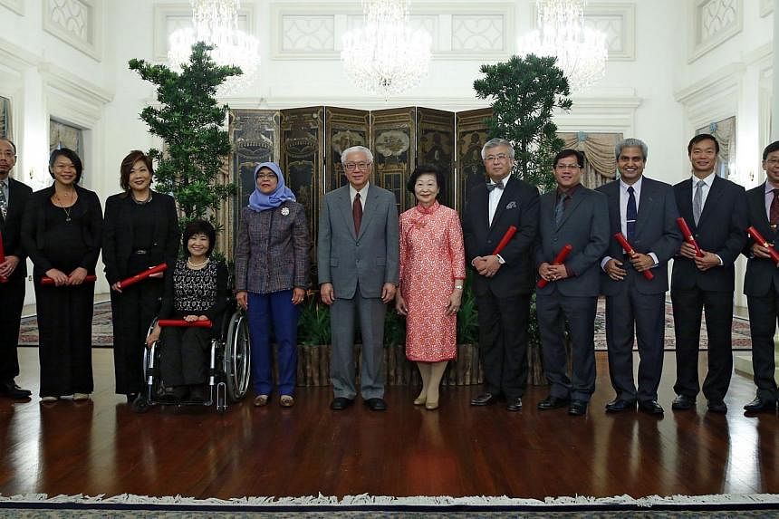 At the Istana after the ceremony are (from left) Nominated Members of Parliament associate professor Randolph Tan, Kuik Shiao-Yin, Rita Soh, Chia Yong Yong, Speaker of Parliament Halimah Yacob, President Tony Tan Keng Yam and wife Mary Tan, NMPs Thom