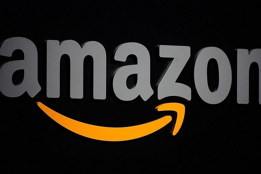 A&nbsp;file photo showing the Amazon logo displayed at a press conference in New York. The Internet retail giant&nbsp;is buying the videogame platform Twitch for US$1 billion (S$1.2 billion), The Wall Street Journal reported Monday. -- PHOTO: AFP