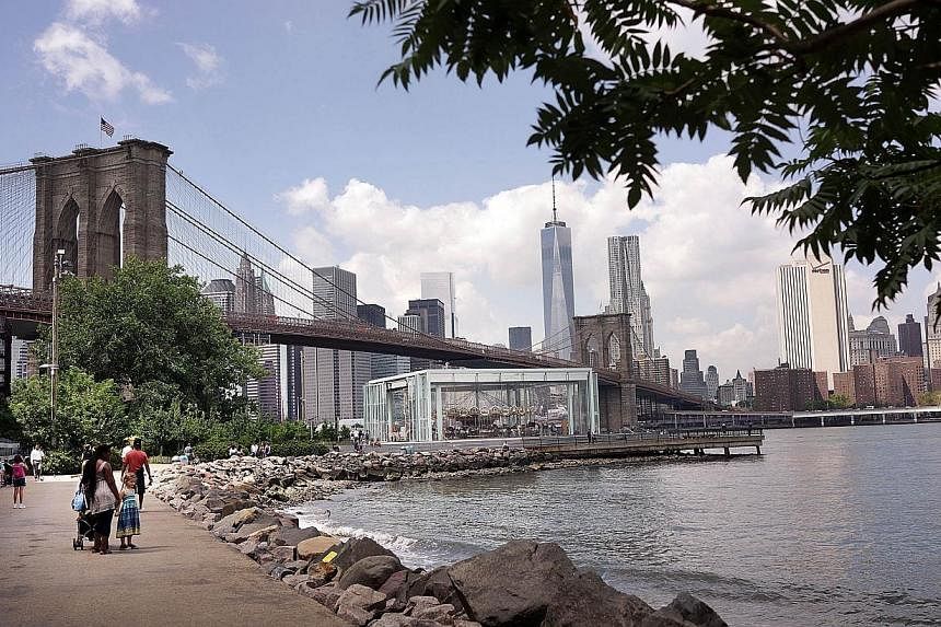 The Brooklyn Bridge is viewed from a park in DUMBO - an acronym for Down Under the Manhattan Bridge Overpass - on August 19, 2014 in the Brooklyn borough of New York City.&nbsp;A Russian tourist was arrested, police said on Monday, after scaling the 