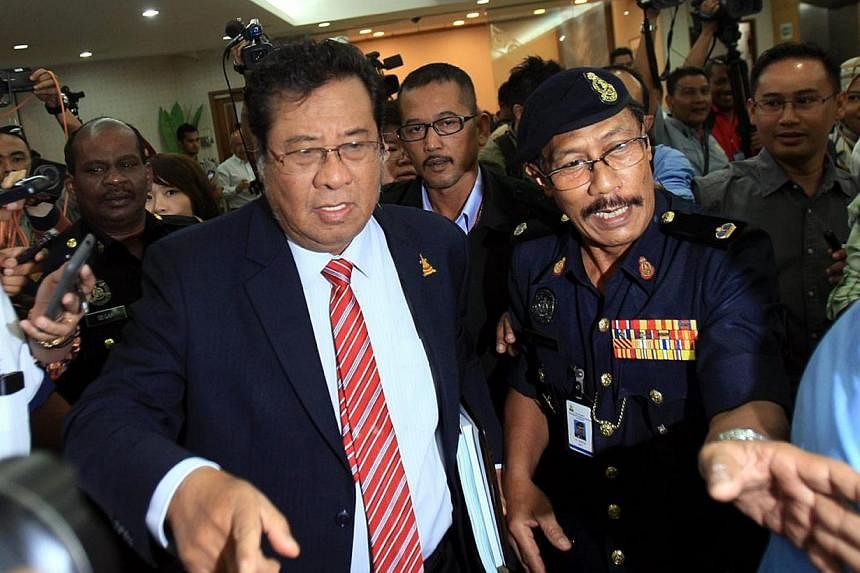 Selangor's sultan on Tuesday asked Tan Sri Abdul Khalid Ibrahim (left) to postpone his resignation as the state's chief minister until the palace can determine his replacement. -- PHOTO: THE STAR/ASIA NEWS NETWORK