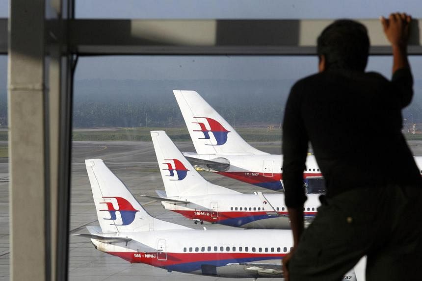 Nearly 200 cabin crew have resigned from Malaysia Airlines which was hit by two deadly tragedies this year, the carrier said on Tuesday, and some reportedly cited fears for their safety. -- PHOTO: REUTERS