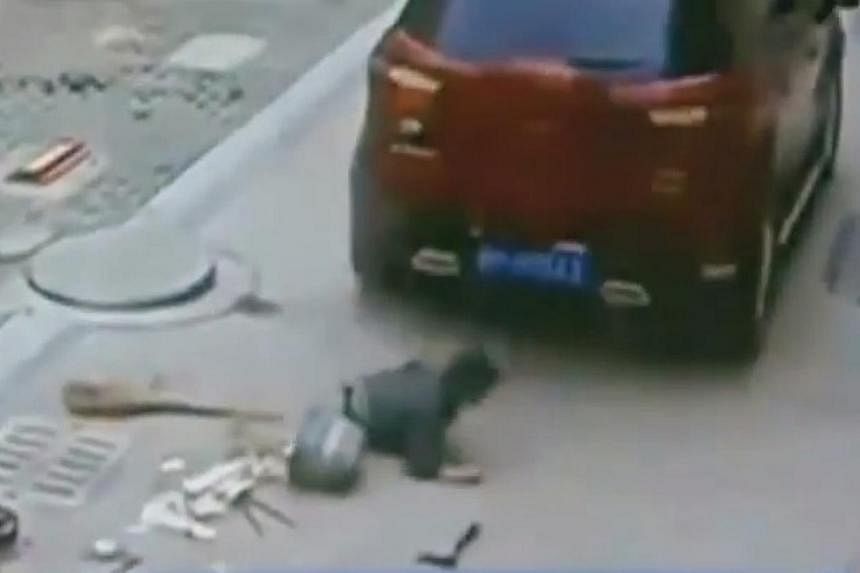 In a shocking video published on Aug 25, a Chinese boy is seen miraculously getting back on his feet after an SUV runs over him. -- PHOTO: SCREENGRAB FROM YOUTUBE