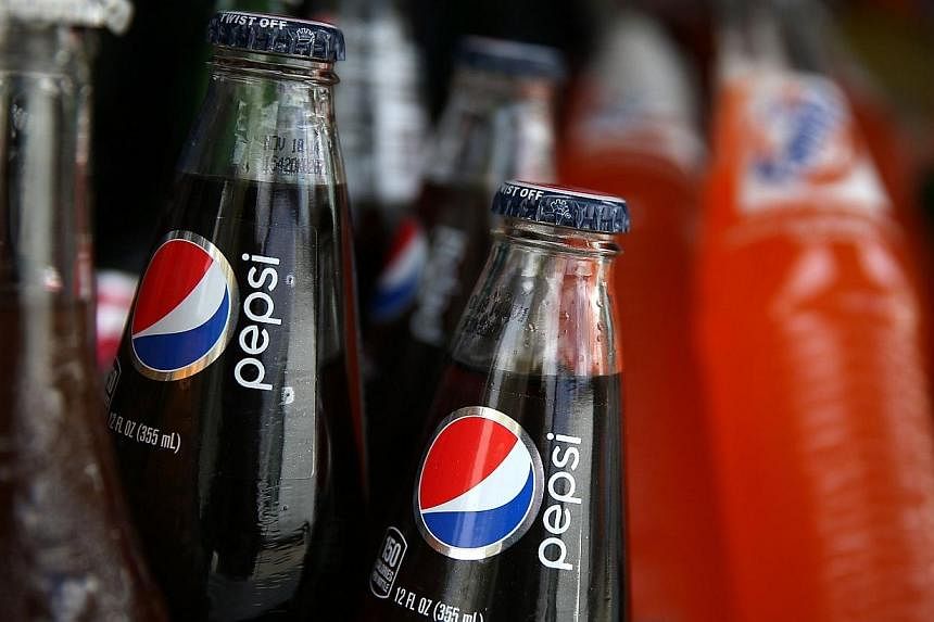 Bottles of Pepsi are displayed in a food truck's cooler on July 22, 2014 in San Francisco, California.&nbsp;India has asked US soft drinks giant PepsiCo to reduce the sugar content of its sodas as the country battles growing levels of obesity and dia