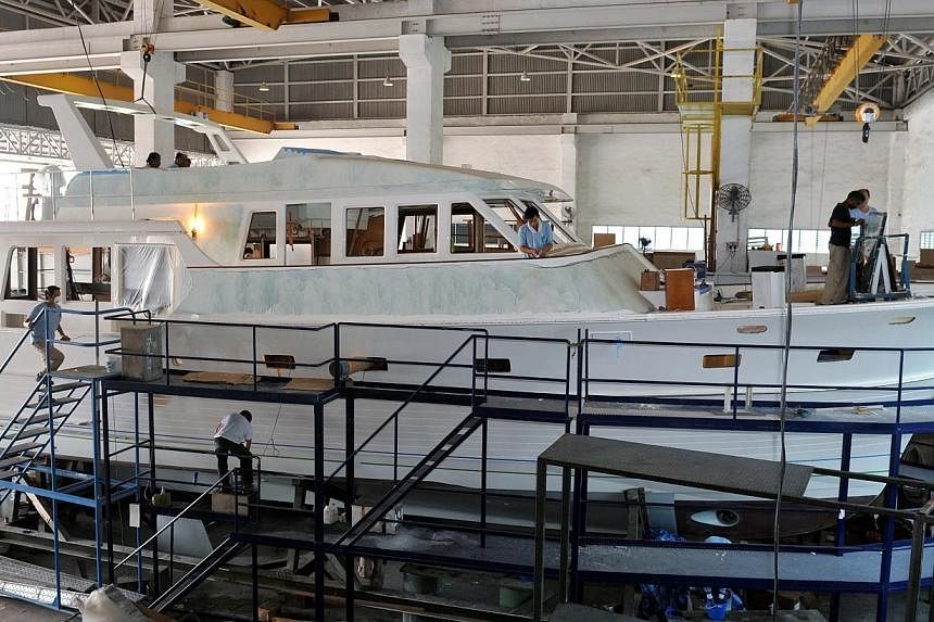 Building yachts to order at Grand Banks Yachts.&nbsp;Stronger demand for luxury boats in North America and Asia helped Singapore-listed yacht maker Grand Banks Yachts post its first full-year profit in six years. -- PHOTO: ST FILE