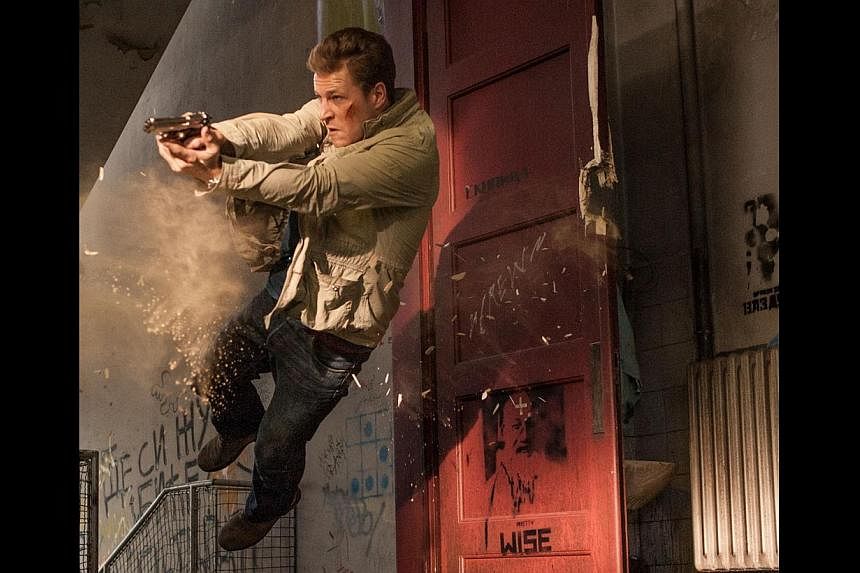 Luke Bracey had never handled firearms before filming November Man and had to train hard to look convincing as a gun-toting spy in the movie. -- PHOTO: SHAW ORGANISATION
