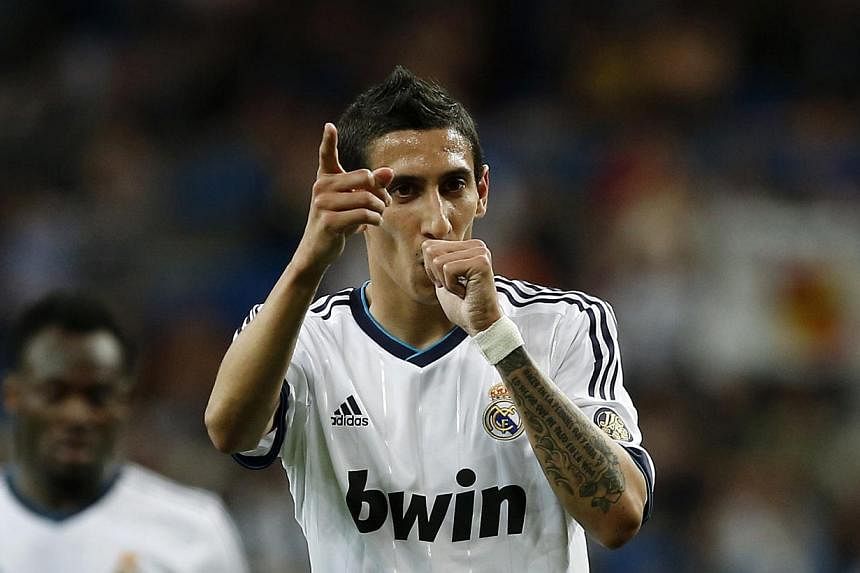 Real Madrid's Angel Di Maria celebrates his goal against Malaga during their Spanish first division soccer match at Santiago Bernabeu stadium in Madrid in this May 8, 2013 file photo. -- PHOTO: REUTERS