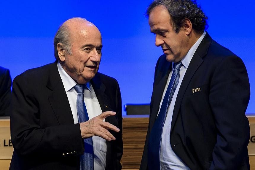 European football chief Michel Platini (right) on Thursday will announce if he is to stand against Sepp Blatter (left) in next year’s Fifa presidential election. -- PHOTO: AFP