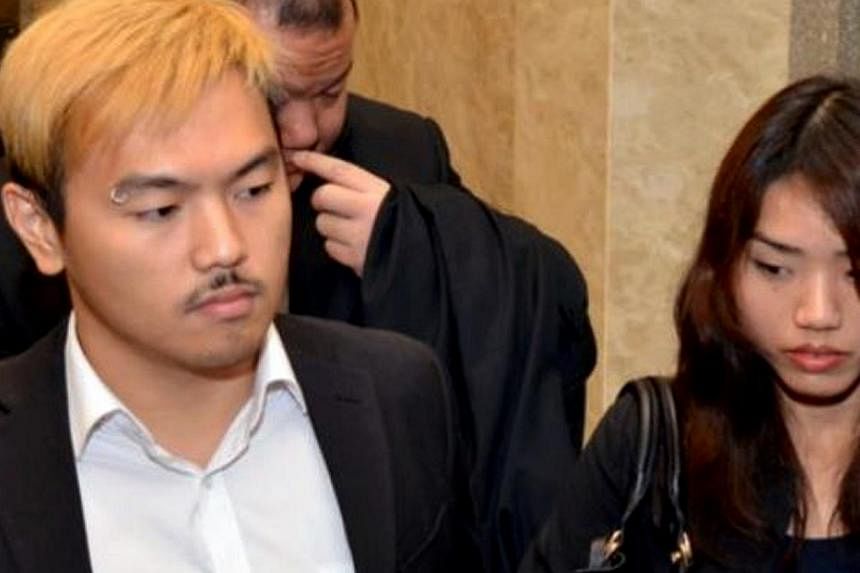Controversial Malaysian sex bloggers Alvin Tan (left) and Vivian Lee leaving the Sessions Court in Kuala Lumpur on May 12, 2014. -- PHOTO: THE STAR/ASIA NEWS NETWORK&nbsp;