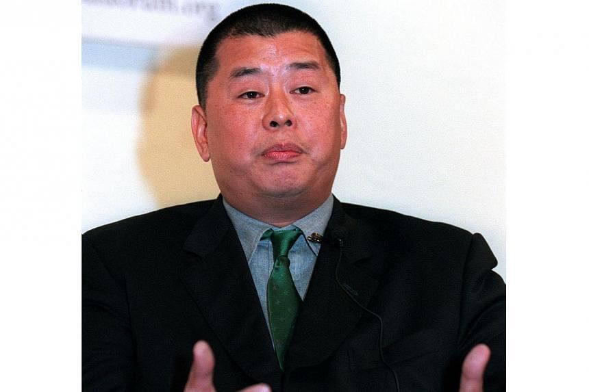 Anti-corruption officers in Hong Kong on Thursday morning raided the home of Jimmy Lai, a media magnate and an outspoken critic of Beijing who has supported pro-democracy activists through his many publications. -- PHOTO: APPLE DAILY